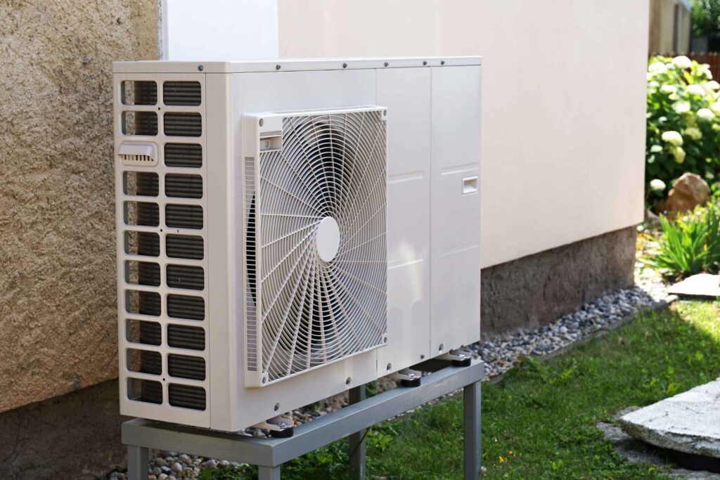 Angled view of a newly installed exterior heat pump unit